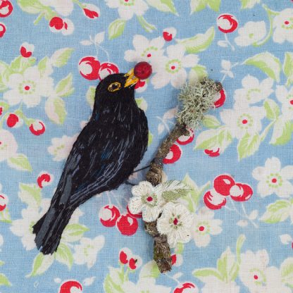 Blackbird with berry