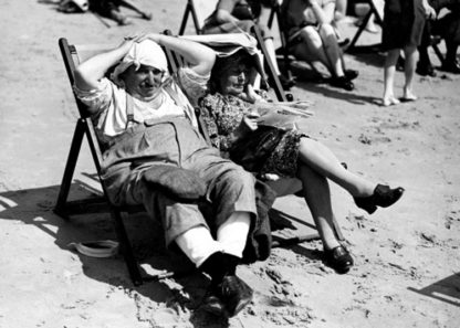 Couple sitting in deck chairs