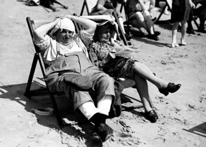 Couple sitting in deck chairs