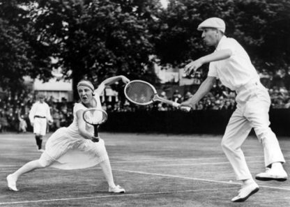 Couple playing tennis