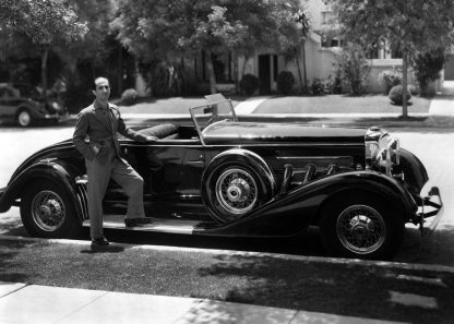 Man and long car