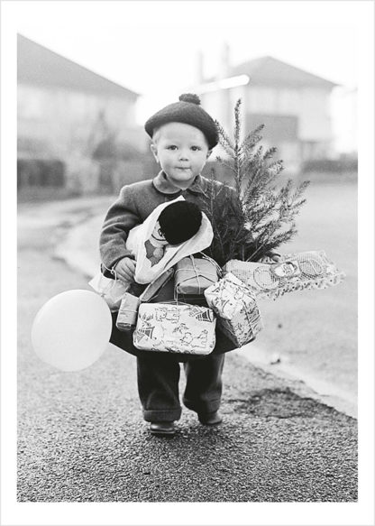 Boy with presents and tree