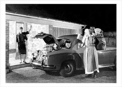 Father Christmas outside house with car