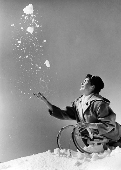 Woman throwing snow in the air