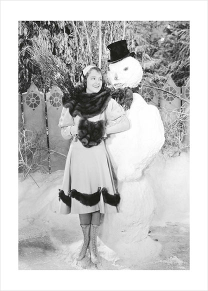 Posing with snowman