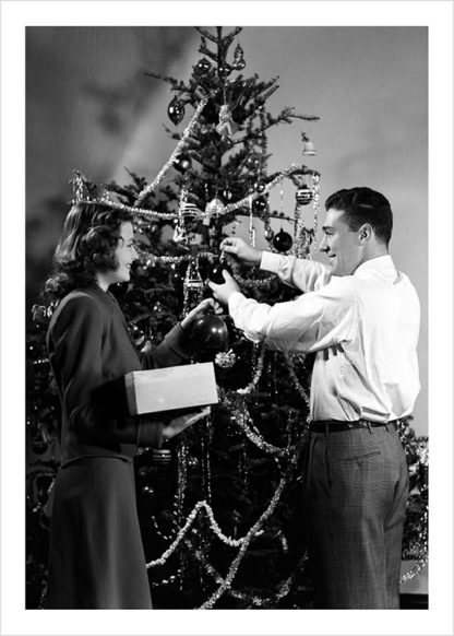 Couple decorating tree