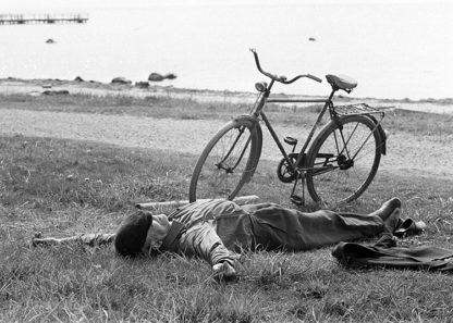 Man sleeping beside bike