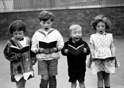 Children singing in schoolyard