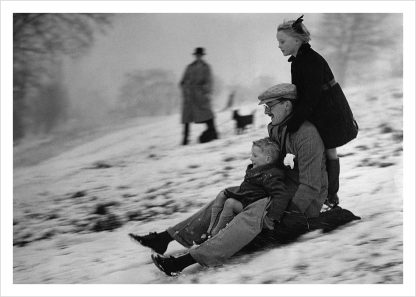 Family tobogganing on Hampstead Heath