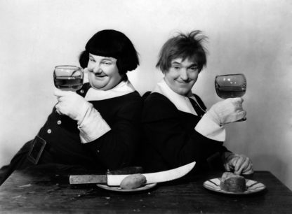 Laurel and Hardy raising a glass