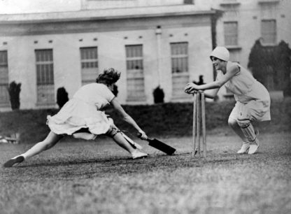 Women playing cricket