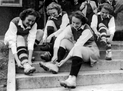 Female footballers booting up