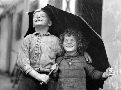 Children sharing an umbrella