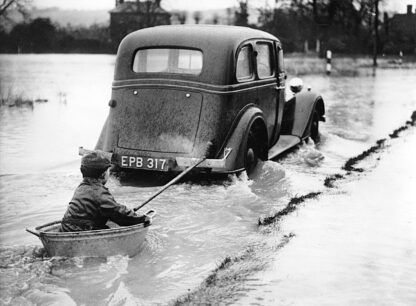 Getting a tow through the floods