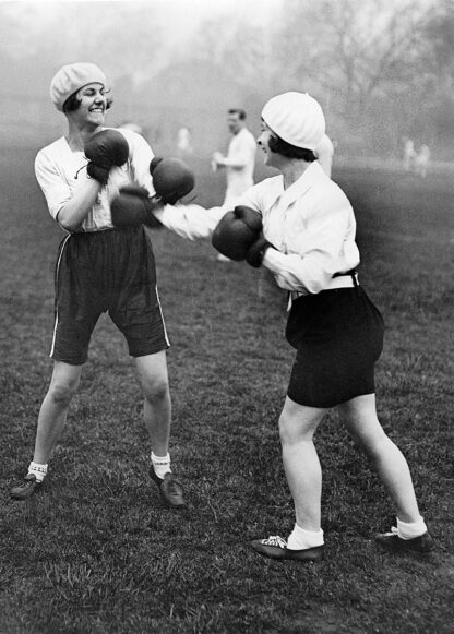 Two girls boxing