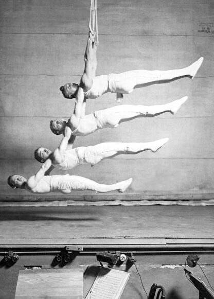Four suspended gymnasts