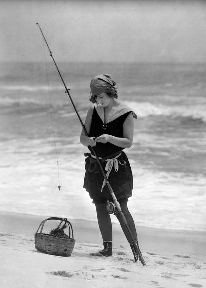 Girl fishing on the beach